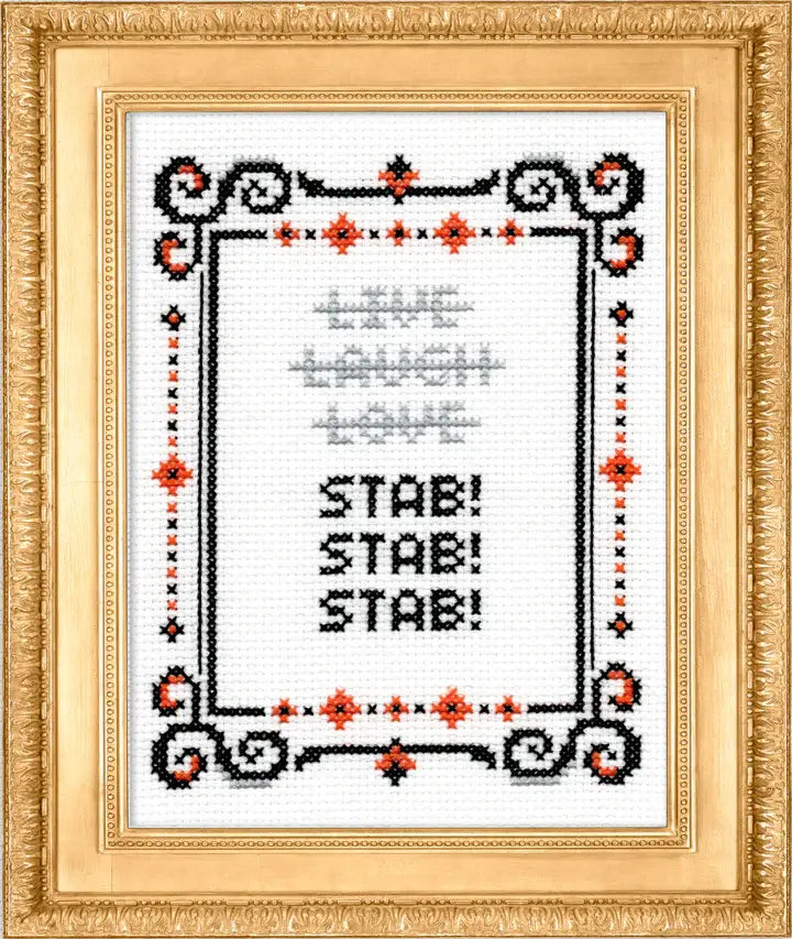 Cross-stitched design with text 'Live Laugh Love STAB! STAB! STAB!' on a white background with decorative border.